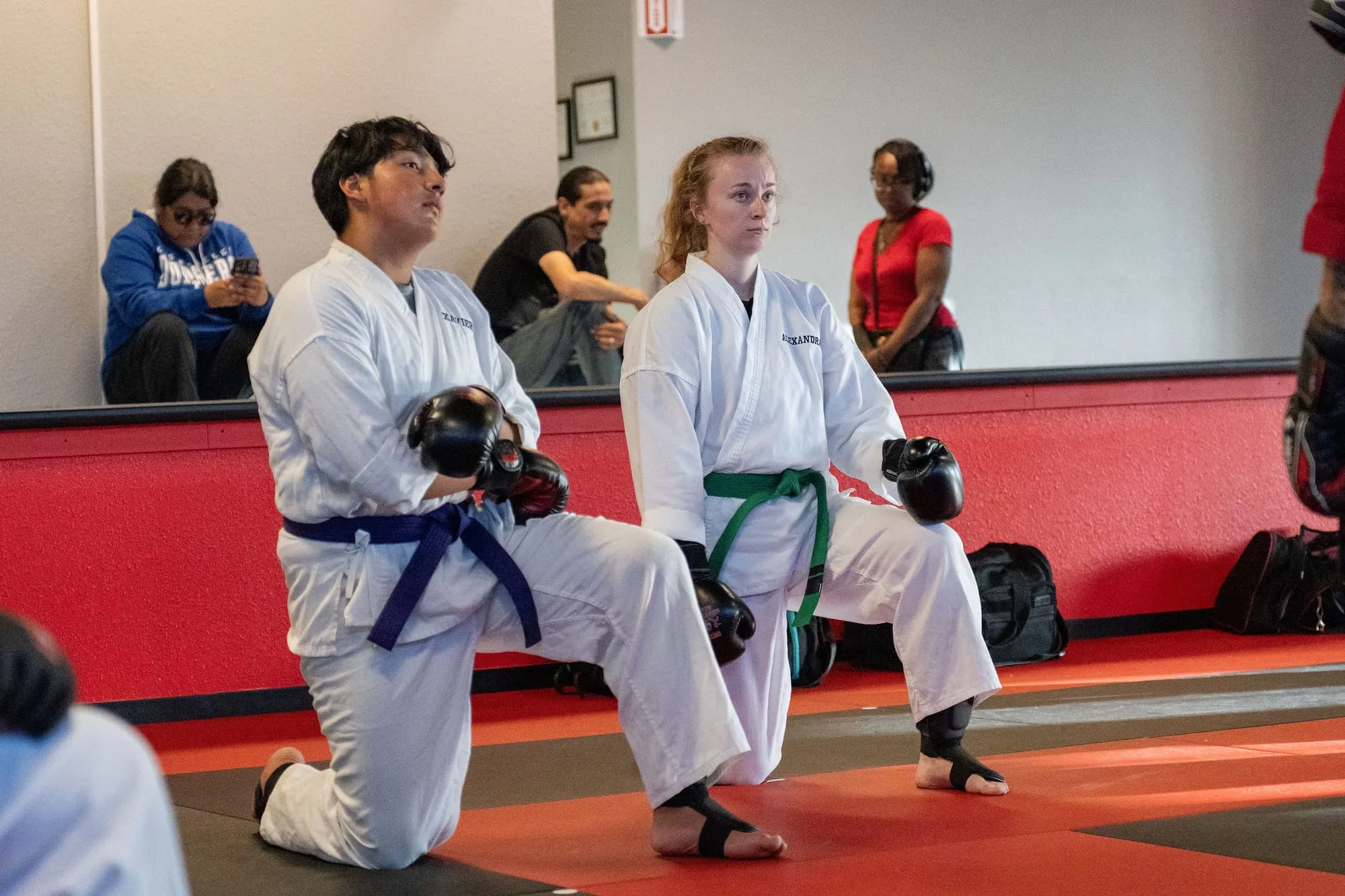 Teen and adult students of different belt levels training side by side in the Teen and Adult MMA class at Guido's Martial Arts Academy in Clovis, CA