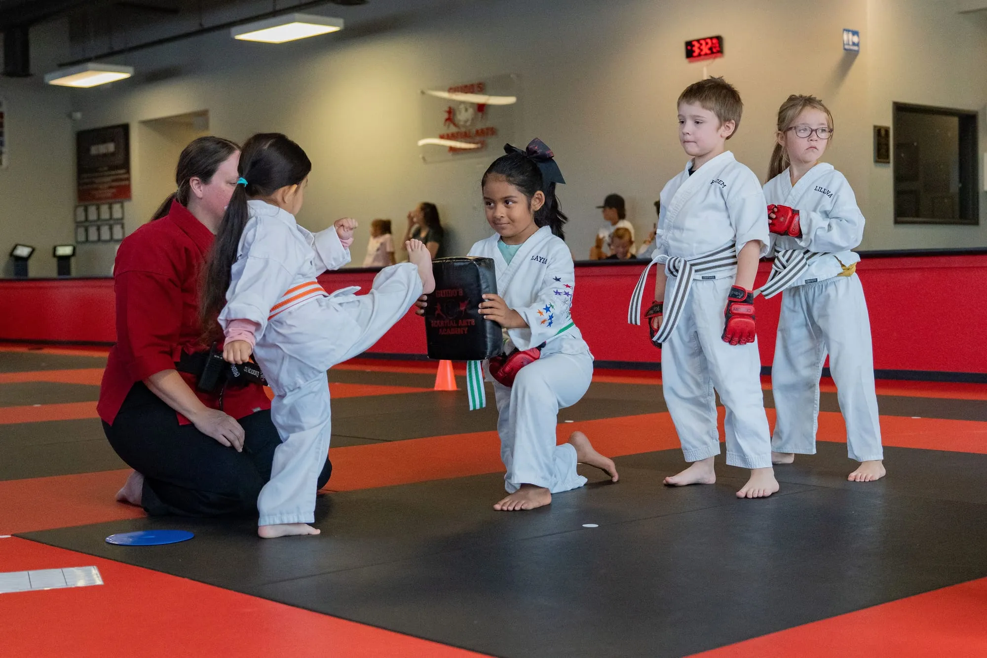 Smiling young Little Ninjas student in a white gi with yellow belt at Guido's Martial Arts Academy in Clovis