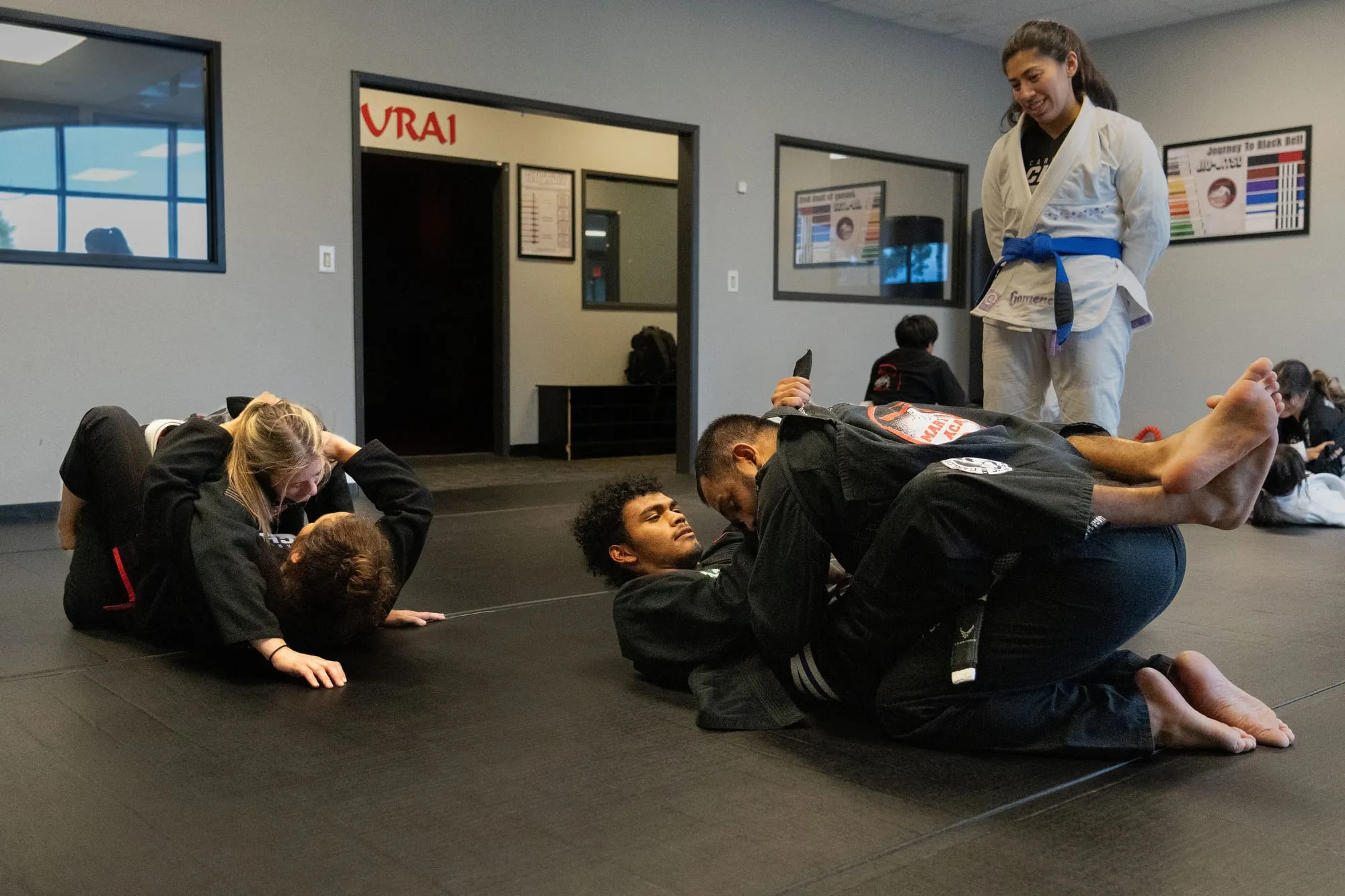 Two adult BJJ students rolling on the mat at Guido's Martial Arts Academy in Clovis