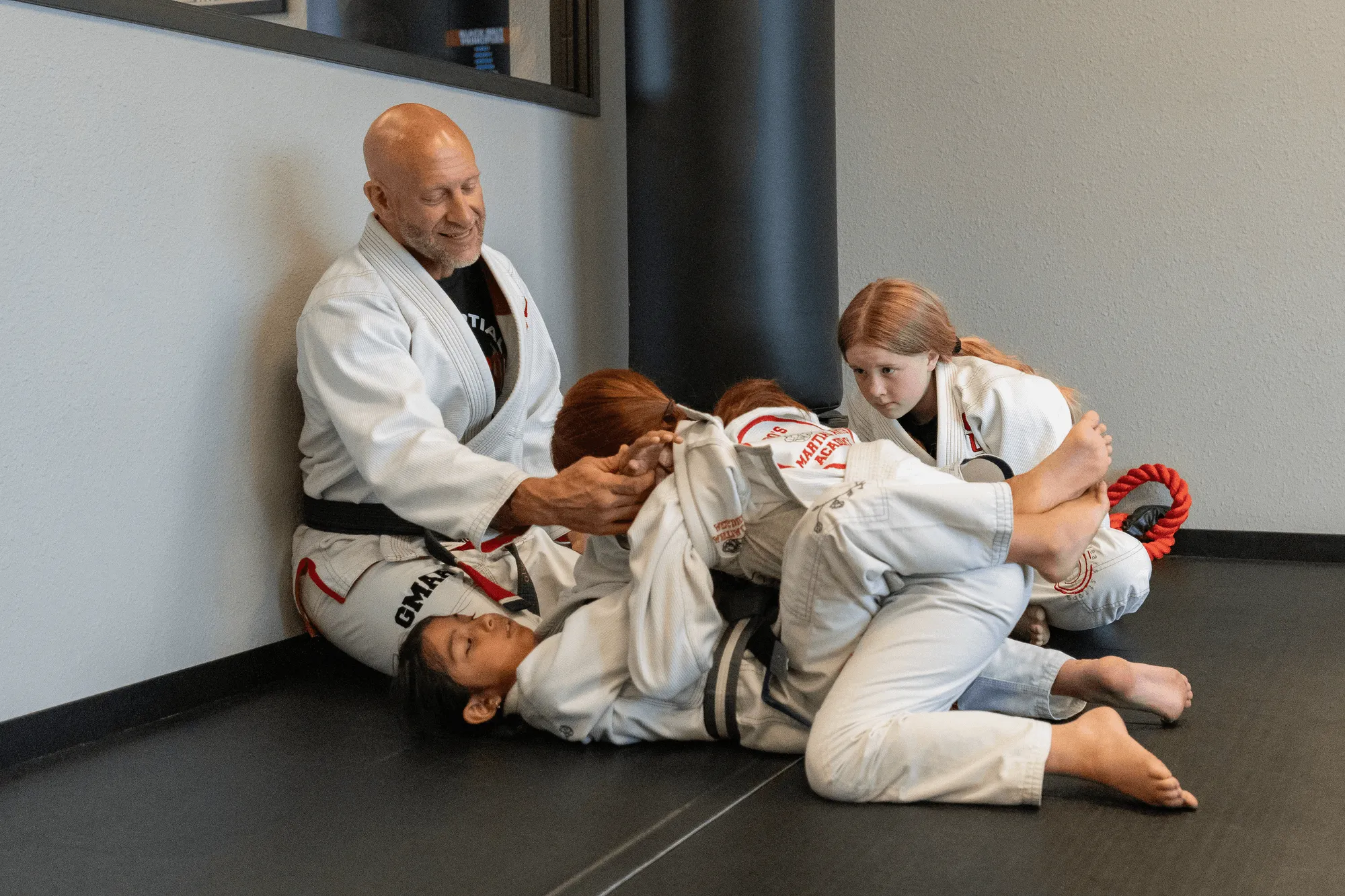 Juniors BJJ students drilling positions on the mat at Guido's Martial Arts Academy in Clovis, CA