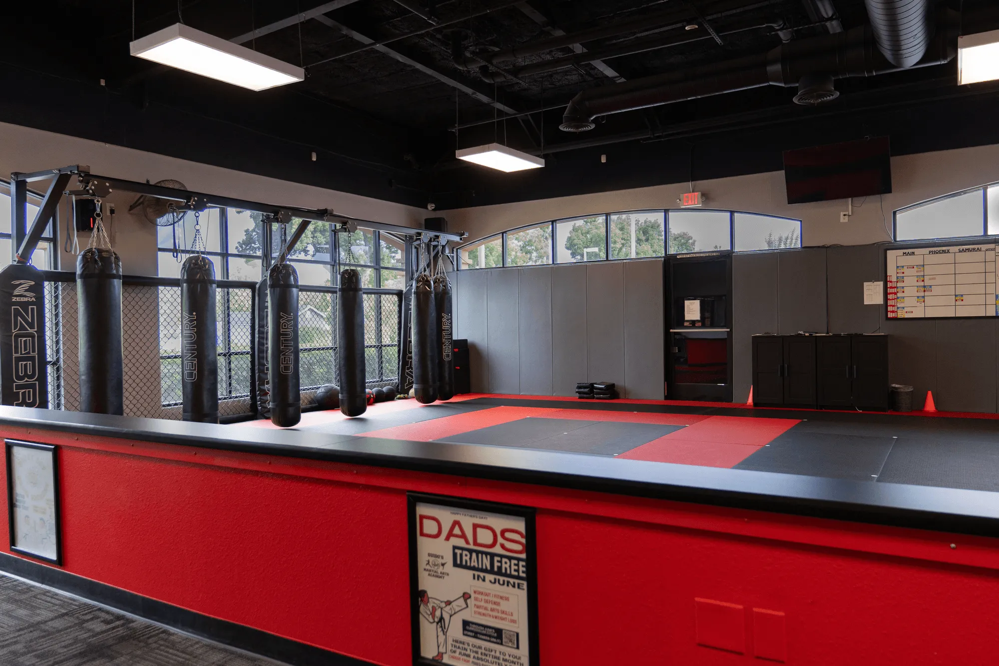 A folded white gi and worn black belt on a bench at Guido's Martial Arts Academy in Clovis, CA