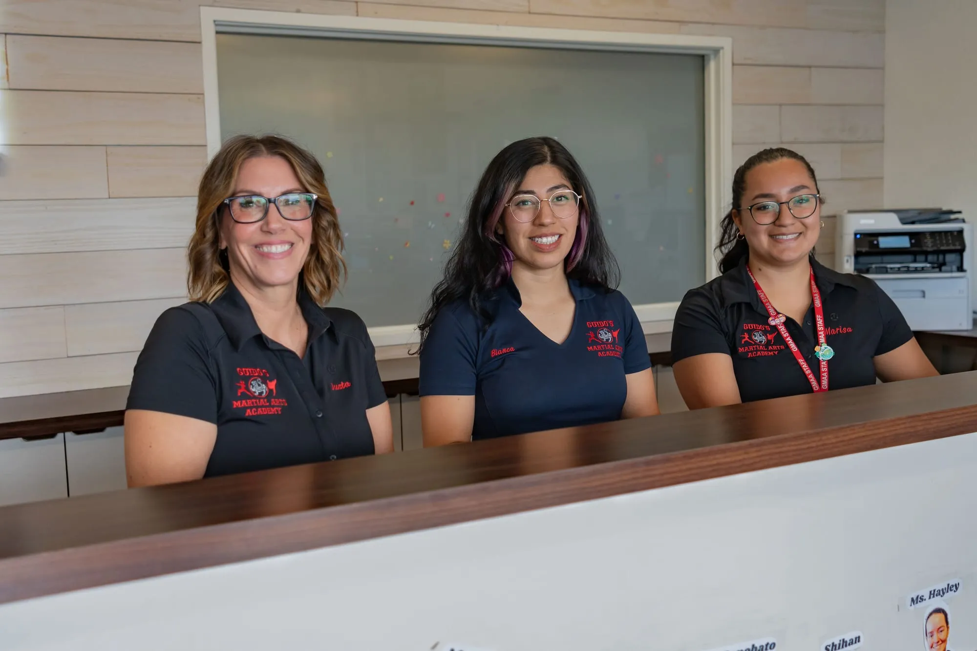 New family being welcomed by the front desk team at Guido's Martial Arts Academy in Clovis